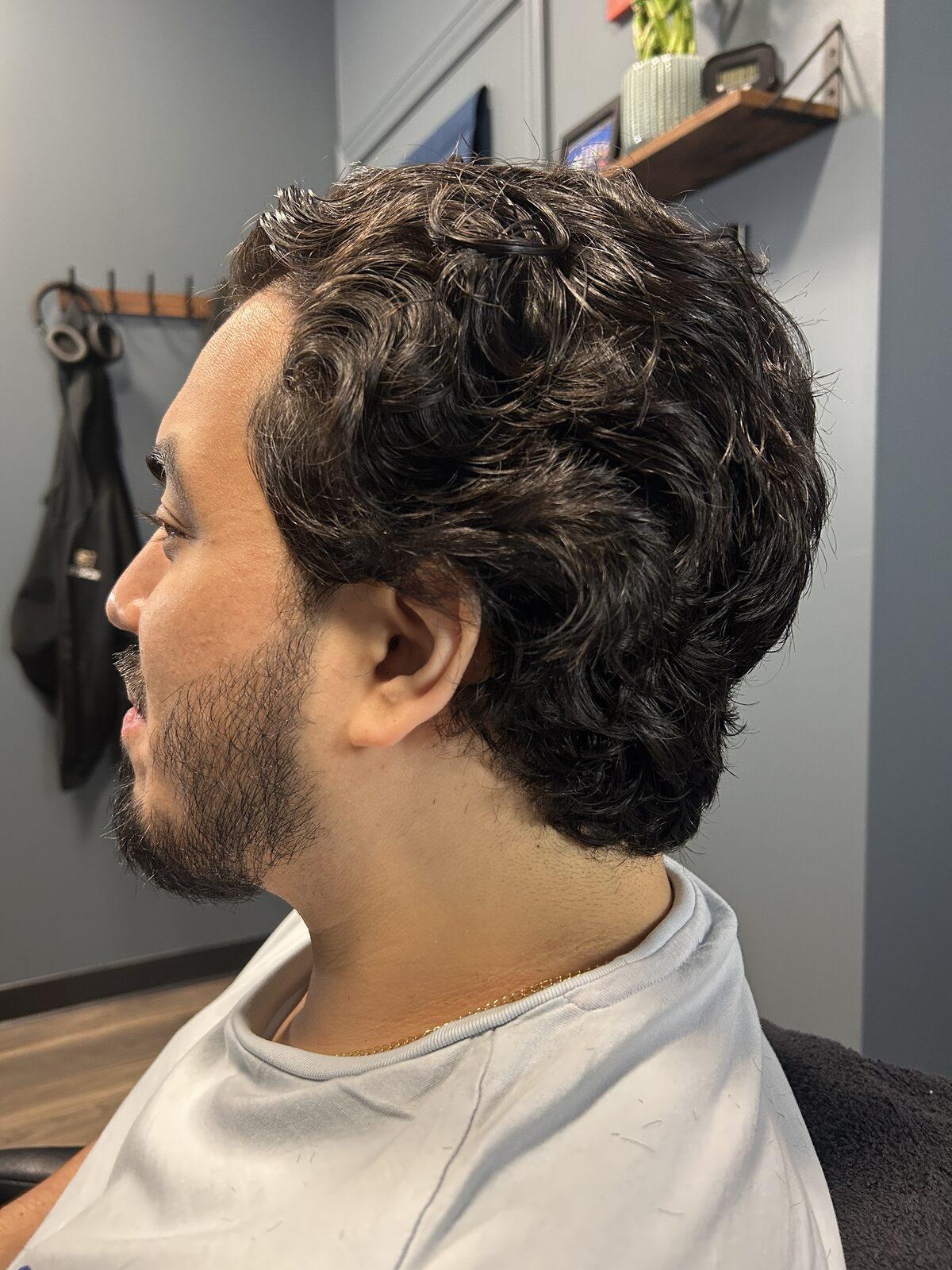 Curly textured taper showing natural wave and movement