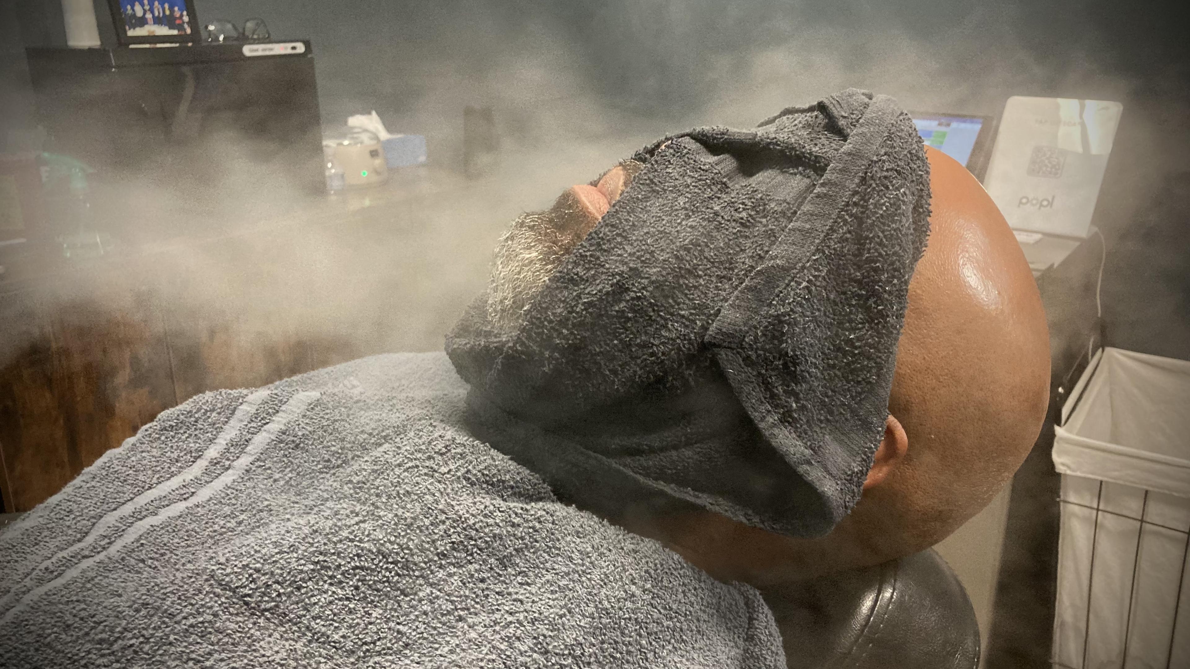Hot-towel steam during a straight-razor shave