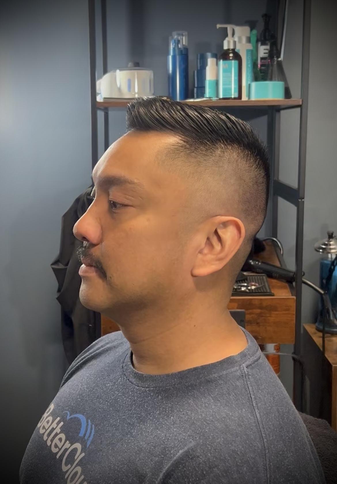 Classic side part with a high skin fade
