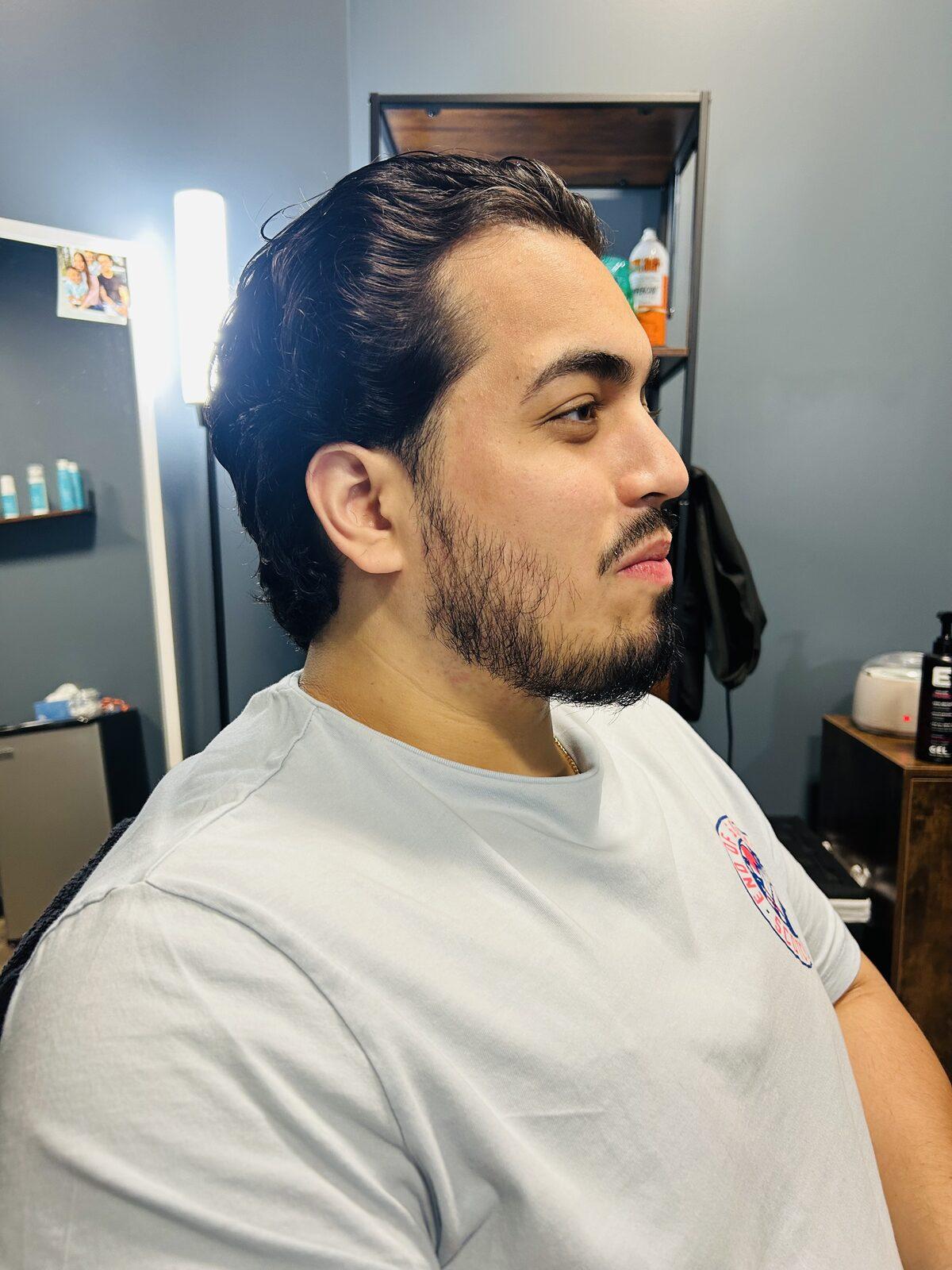 Tapered long layers swept back with a natural beard