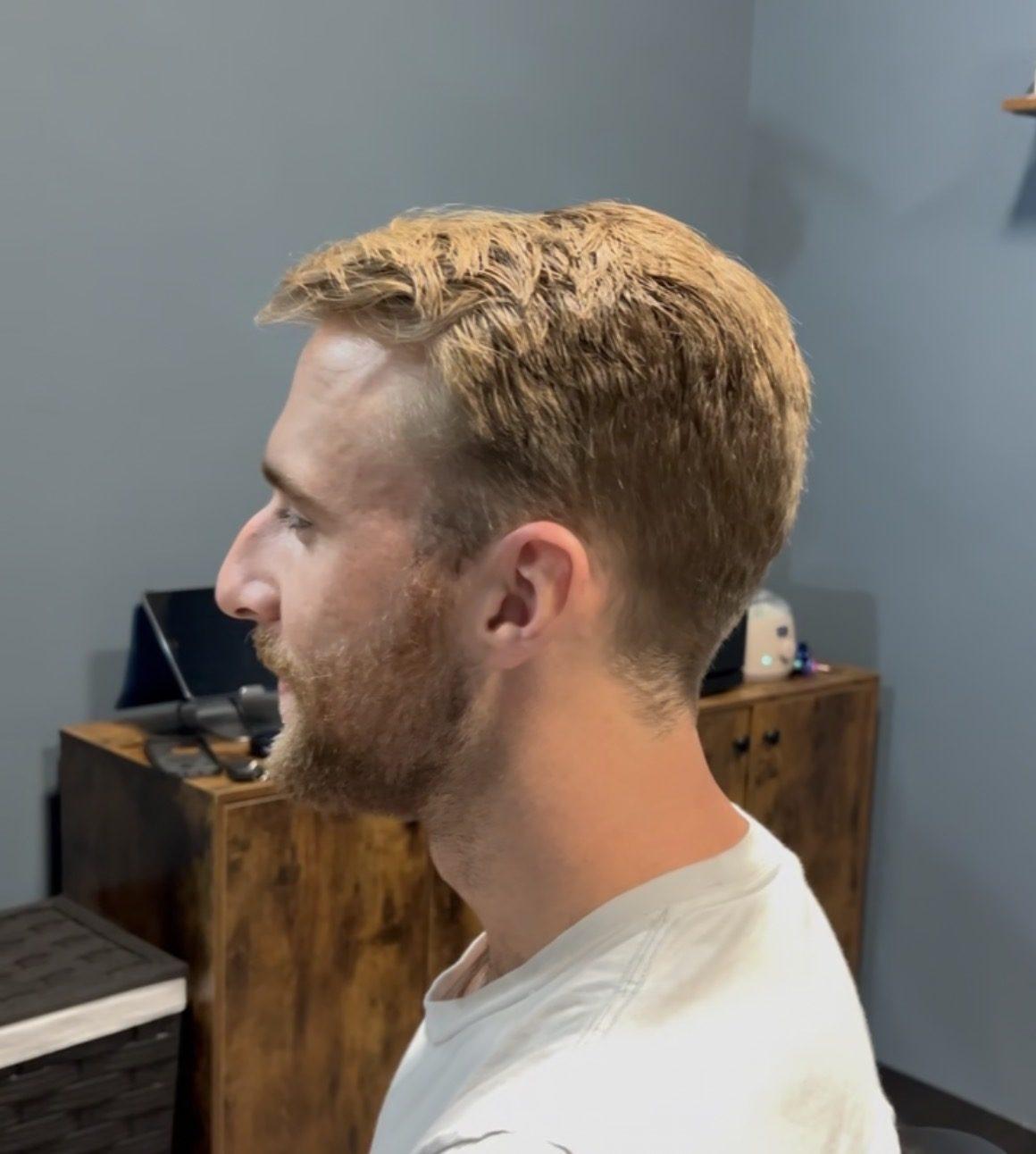 Textured crop with tapered sides and a natural beard, side profile